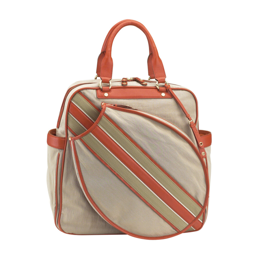 An Orange and Cream Color Bag With Racket Slot