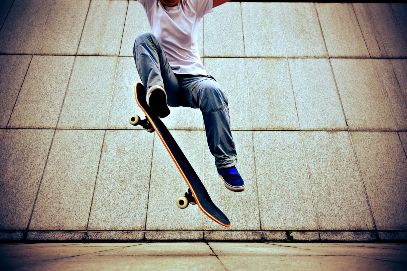 A Man Jumping on a Skateboardin SHoes
