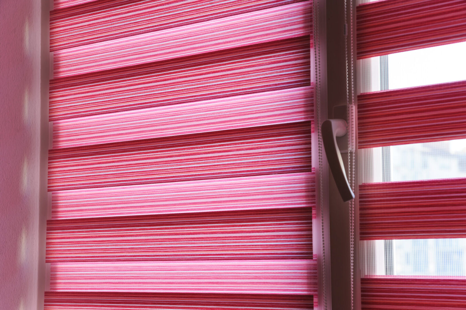 A Pink and White Color Shade Blinds for a Window