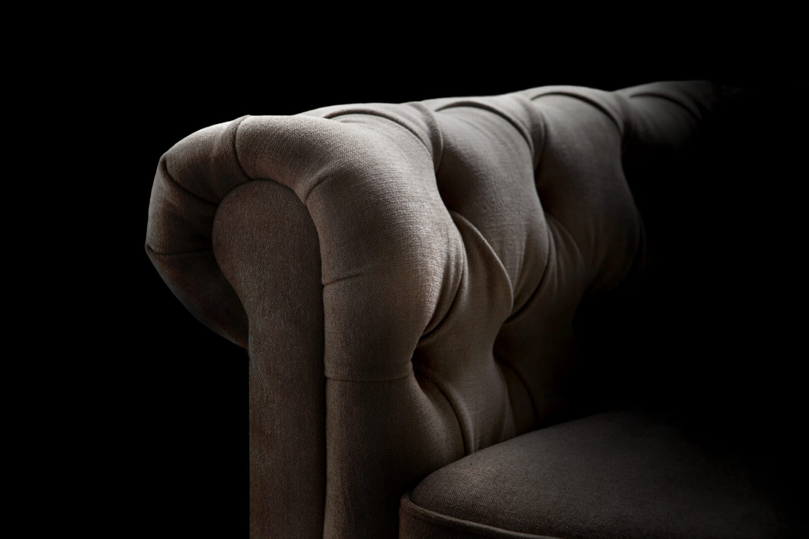 A Grey Color Knitted Couch in the Dark