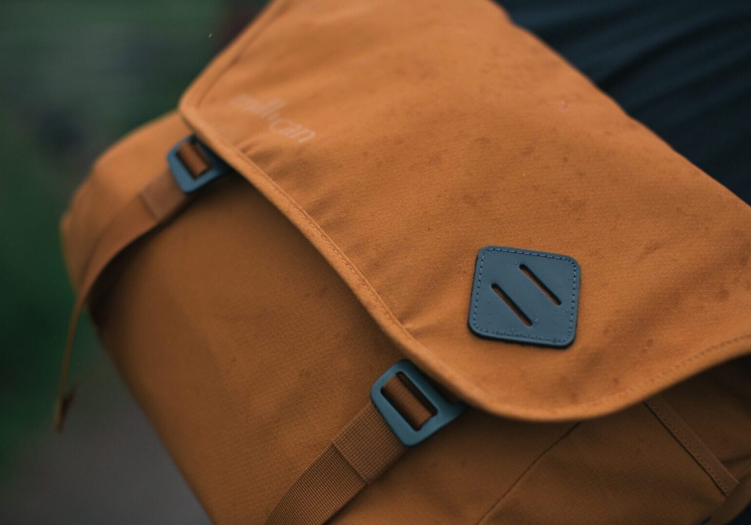 A Tan Color Mess Bag With Brown Straps